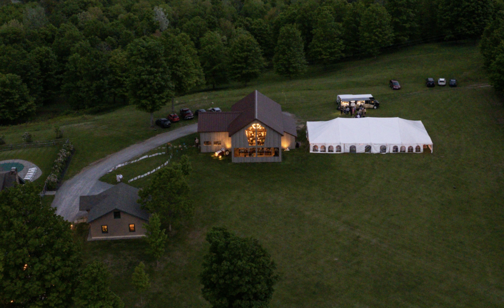 Aerial view of the Twin leaf Farm, showcasing the barn & a wedding tent for a saratoga wedding venue